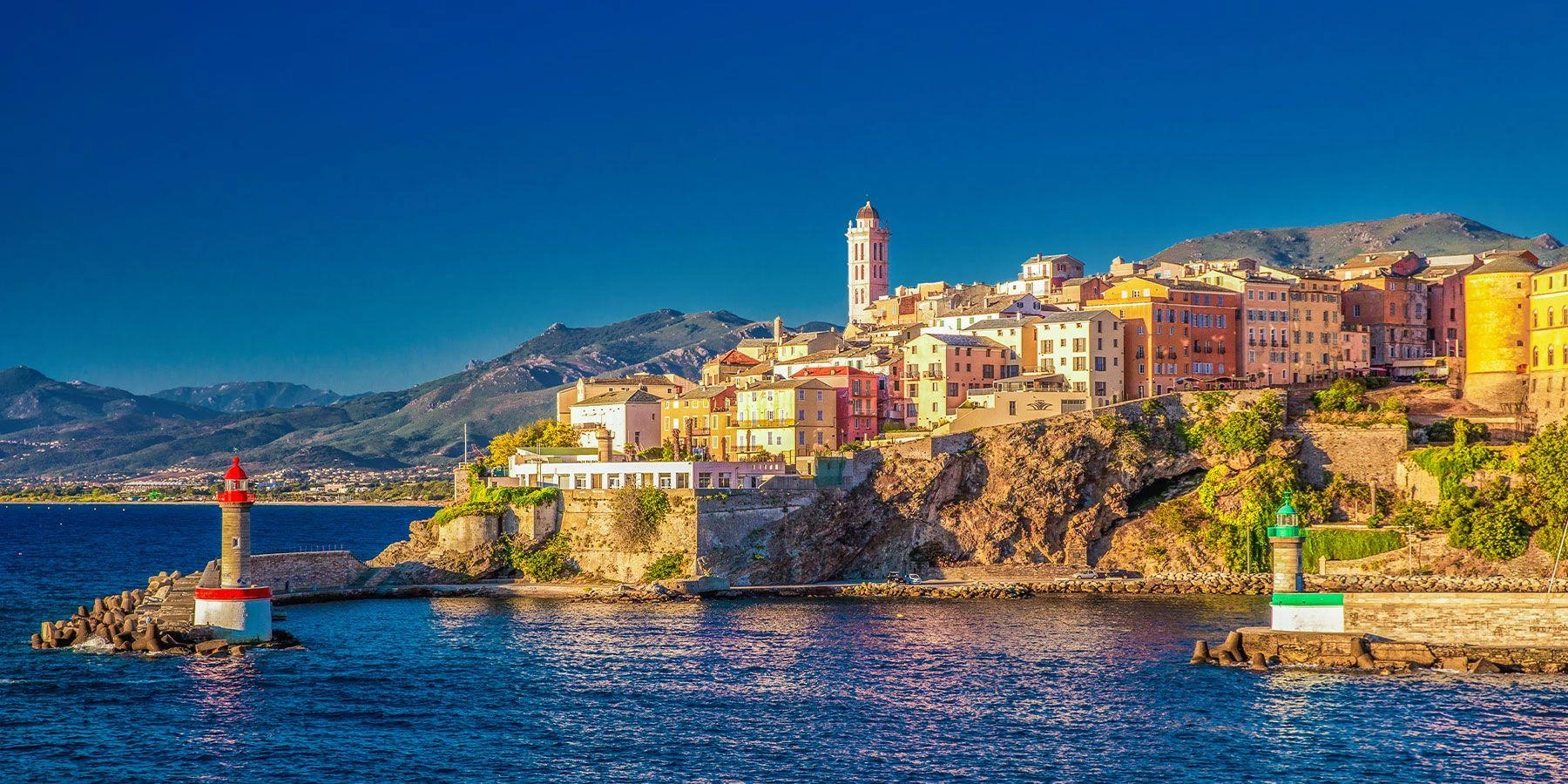 Bastia old harbour, waterfront houses and Corsican hills