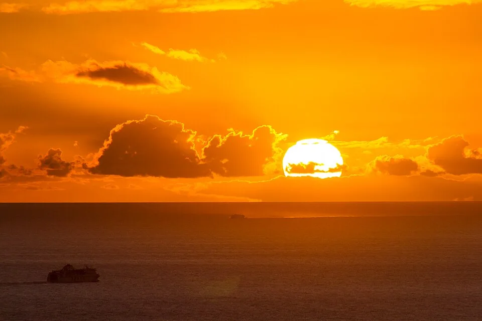 Example: Ferries crossing the sea during sunset outside Tenerife